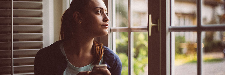 Woman staring out the window