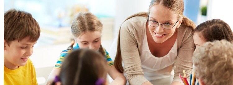 Teacher helping students