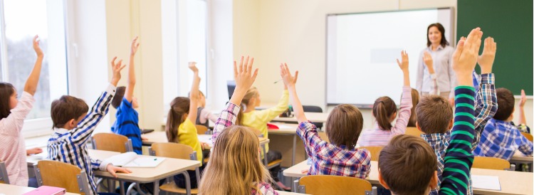 Teacher helping students