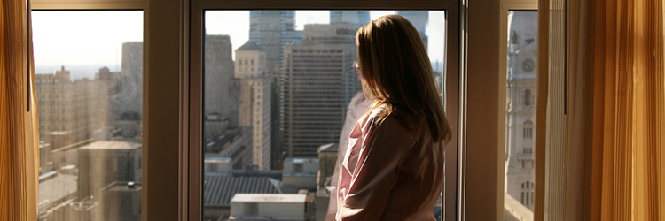 Woman staring out window